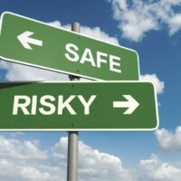 Safe And Risky Sign Stock Photo