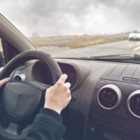 Man Driving His Vehicle On The Interstate Stock Photo