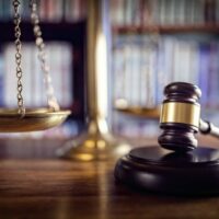 Scales of Justice and judge’s gavel stock photo