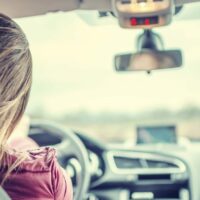 Woman Driving Her Vehicle Stock Photo