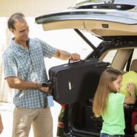 Family Loading Vehicle Before Road Trip Stock Photo | Avoid Car Accident | Labor Day