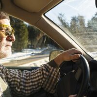 Elderly Man Driving Stock Photo