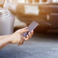 Car Accident – Dialing On Smartphone Stock Photo