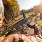 Motorcycle Rider On A Rural Road Stock Photo