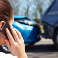 Woman On The Phone After An Accident Stock Photo