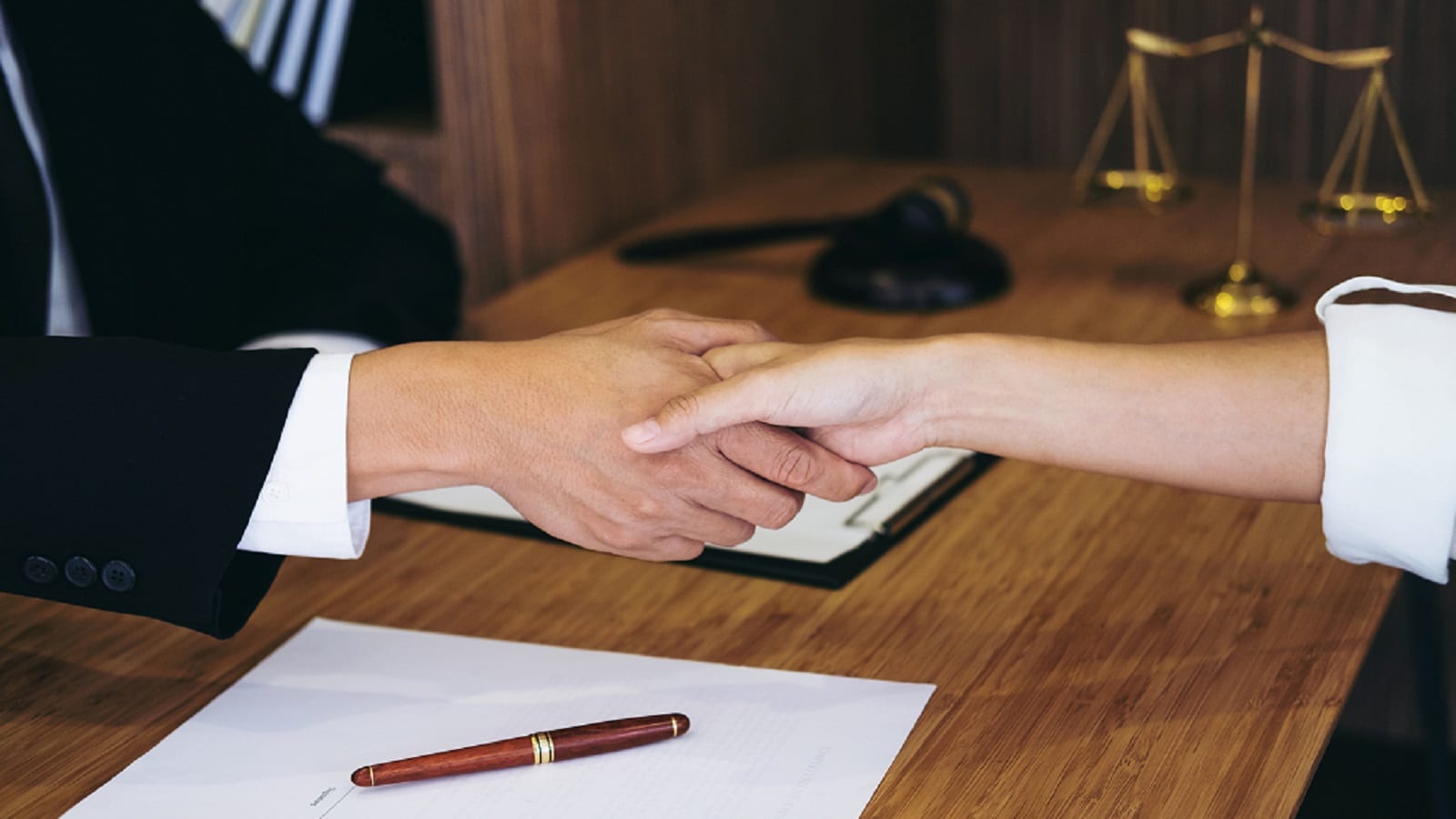Lawyer Shaking Hands With A Client After Meeting